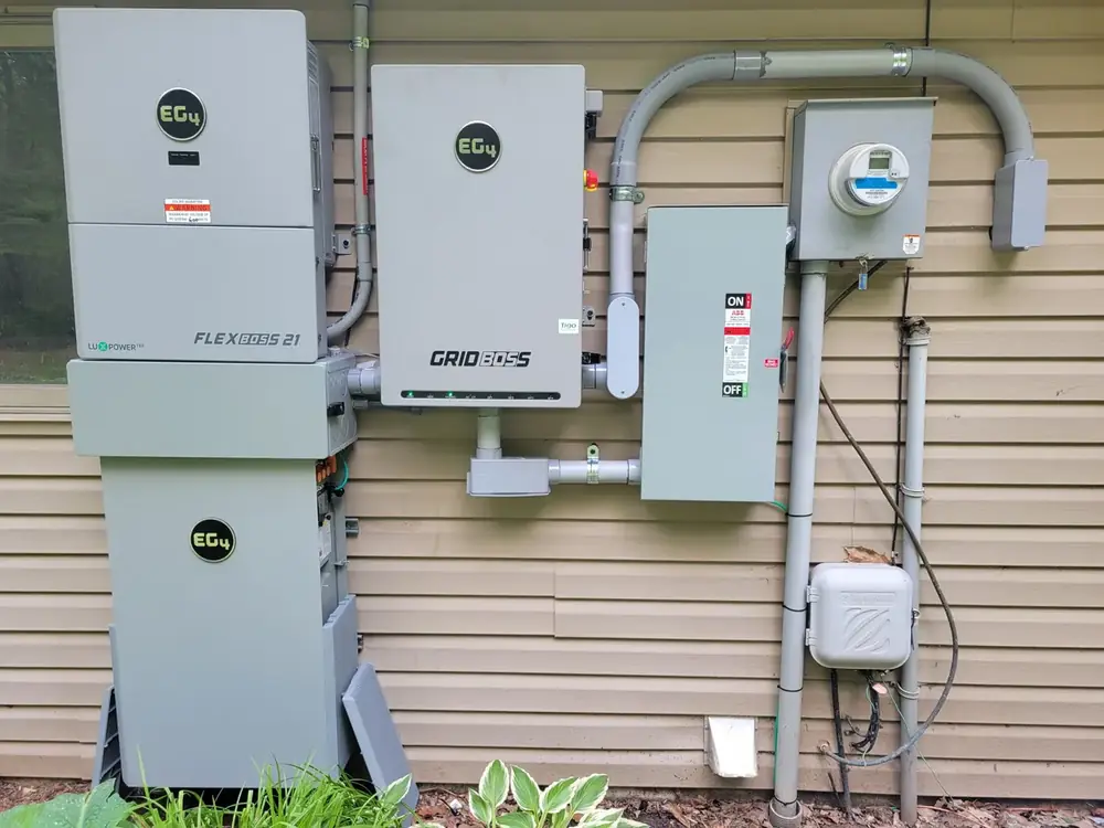 EG4 battery storage and solar power control equipment mounted beside an electric meter